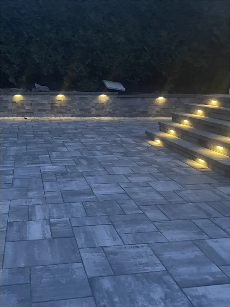 Beautiful garden illuminated with Martin Landscaping and Lighting outdoor lights.