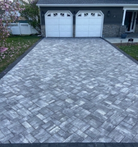Experience the path to perfection with Martin's signature paver driveways, blending beauty and functionality seamlessly.